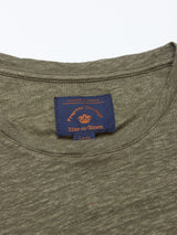 The Totti T-Shirt - Army by Blue de Gênes features an olive green natural texture with a neckline close-up. A navy label shows Pirouette Heritage and Blue de Gênes in orange, detailing its 100% Linen Jersey composition.