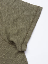 A close-up of the Totti T-Shirt - Army by Blue de Gênes shows the natural texture and meticulous stitching on 100% Linen Jersey. The shoulder and sleeve stand out against a white background, highlighting the fine fabric details of this short-sleeve olive green shirt.
