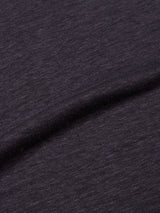 Close-up of the Totti T-Shirt - Dark Navy by Blue de Gênes, featuring dark gray fabric with a soft, natural texture and subtle diagonal folds. Its lightweight material resembles a finely knit 100% linen jersey, showcasing the elegance of high-quality linen crewneck T-shirts.
