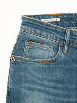 Close-up of Blue de Gênes Vinci Topaz Vintage Jeans - Used: features blue denim, regular fit, front and coin pockets, belt loops, orange stitching, and a Made in Italy label with Italian flag inside the waistband.