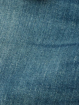 Close-up of Vinci Topaz Vintage Jeans - Used by Blue de Gênes, highlighting the comfort stretch blue denims texture, subtle color variations, and visible individual threads in the weave pattern.