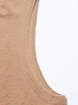 Close-up of the Zorba Knit Waistcoat - Taupe by Blue de Gênes, featuring a beige knitted fabric with a visible armhole and neckline. Made from luxurious Merino wool, the soft texture is slightly mottled against a plain white background.