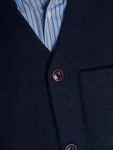Close-up of the Blue de Gênes Koi Wool Gilet in navy, featuring brown buttons and a visible chest pocket, layered over a light blue and white striped dress shirt.