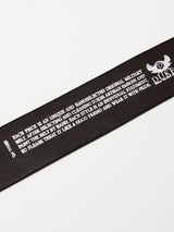 Close-up of a brown leather strap with white embossed text highlighting the brands philosophy of uniqueness, individuality, and pride in crafting premium accessories. The Blue de Gênes logo and Gari Belt name appear on the right side.