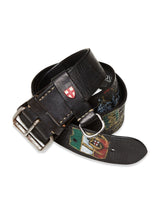 Blue de Gênes Gari Belt - Black is a distinctive piece crafted from premium leather, featuring painted designs and a silver buckle. The black leather coil is adorned with various designs, including a small red and white crest.