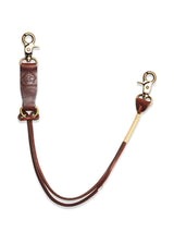 The BGsavino Key Hanger - Brown by Blue de Gênes is crafted from cow leather with two brass swivel clasps, a reinforced loop, logo stamp, and subtle rivet detail for durability.