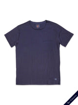 The Blue de Gênes Sagi Nuovo T-shirt in dark navy, made from premium cotton, boasts a small chest pocket with subtle branding on the pocket and hem. Its displayed flat on a white background with diagonal text reading The Classics—an essential wardrobe staple.