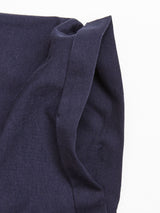 The Sagi Nuovo T-shirt in Dark Navy from Blue de Gênes lies flat on a white surface, showcasing its premium cotton material that is smooth and slightly textured, with a folded corner.