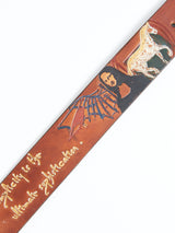 Meet the Da Vinci Belt 4 cm - Brown from Blue de Gênes, a premium leather accessory featuring a vibrant design of a winged woman and horse. The phrase Simplicity is the ultimate sophistication graces it in handwritten style, capturing Leonardo Da Vincis timeless elegance.