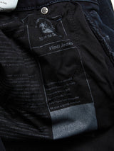 Close-up of a Vinci 3325 Black Jeans label, crafted in Italy by Blue de Gênes. The label emphasizes style and comfort, showcasing stitching and fabric texture. A button and waistline subtly reveal the Comfort Stretch Denim in blue-black hue.