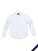 The BDGsandro Oxford Shirt in white by Blue de Gênes is a long-sleeve classic with a front chest pocket, shown flat on a white background. A navy tag at the bottom right reads "The Classics.