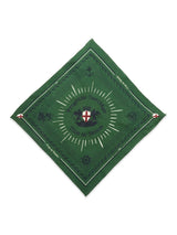 The Green Bandana by Blue de Gênes features a central white and red shield emblem, encircled by Progetto Heritage and Due di Genere, with decorative patterns and symbols along the edges, making it a bold fashion statement.