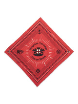 The Blue de Gênes Bandana - Red is a diamond-oriented red square featuring black designs, text, and a faded logo with gear and crown illustrations. It says Progetto Heritage around the logo, complemented by decorative patterns along its edges.