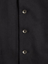 Heres a close-up of the Canna Carbonio Gillet - Black by Blue de Gênes, made from Italian brushed cotton. It features three engraved Buffalo horn silver buttons that shine subtly against the smooth fabric.