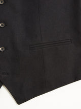 Featuring the Canna Carbonio Gillet by Blue de Gênes, this elegant black jacket is crafted from Italian brushed cotton with a single welt pocket and refined Buffalo horn buttons. Its smooth texture enhances its formal and sophisticated look.