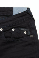 Close-up of the upper section of Blue de Gênes Repi 3325 Black Jeans, highlighting the front and coin pockets, waistband with a navy blue card, and the durable black denim fabric with detailed stitching.