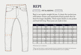 Illustration of Repi Dai V Dark Jeans - Dark Blue Denim by Blue de Gênes with detailed fit and size info. These regular slim-fit jeans, made from comfort stretch denim, feature button closure, asymmetrical back pockets, and patch repair details. Size chart includes waist, thigh, knee, and leg opening in cm.