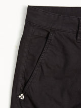 Close-up of the upper section of the Blue de Gênes Teo Chino - Jet Black, highlighting the waistband, belt loop, side pocket, and a small decorative metal detail near the pocket.