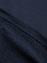 Close-up of the BGclubhouse Rugby Sweatshirt - Navy by Blue de Gênes, showing a visible seam dividing two textured sections; the upper section features a smooth, classic cotton jersey finish, while the lower section showcases a coarser weave reminiscent of authentic athletic heritage.