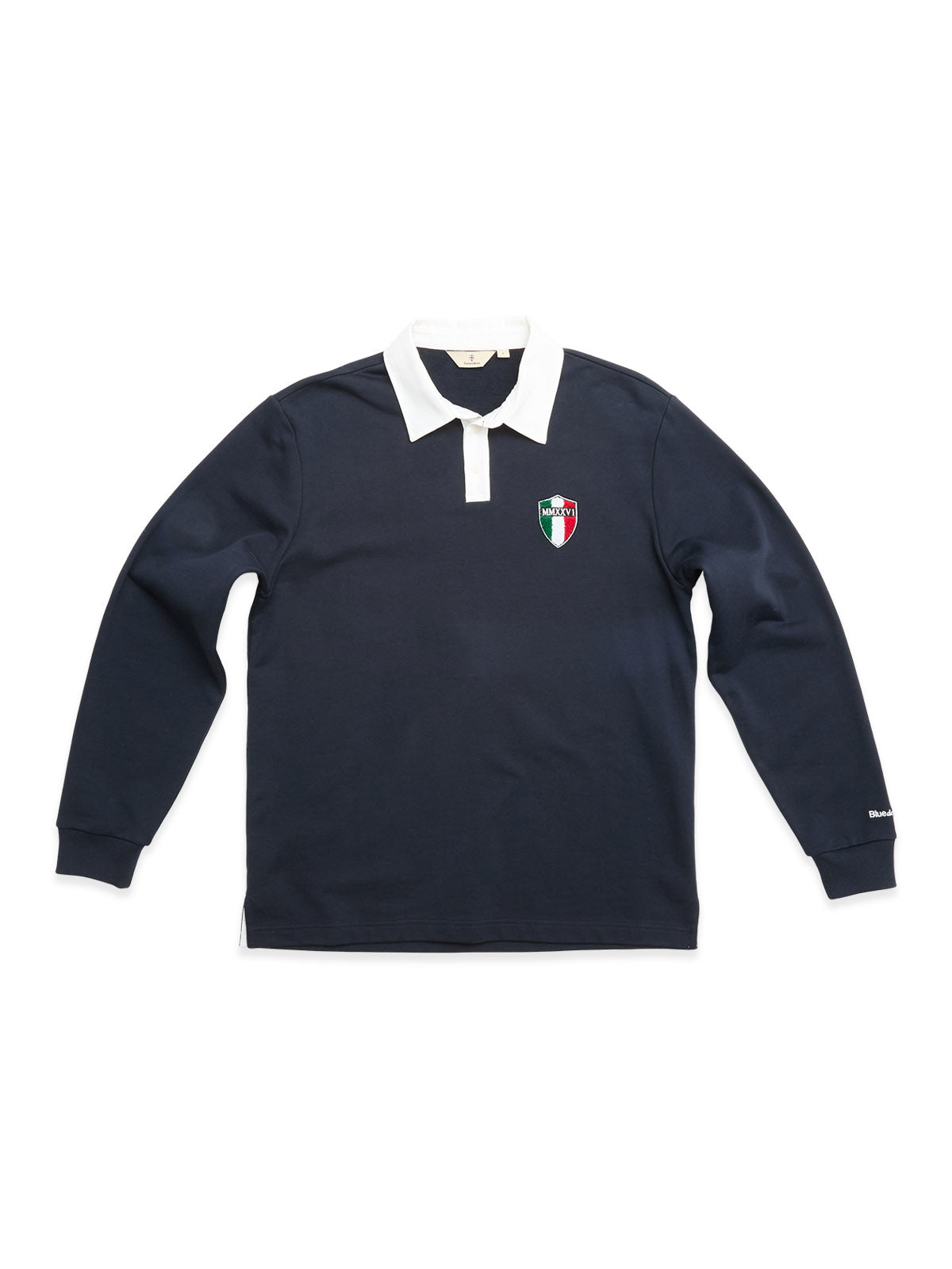 The BGclubhouse Rugby Sweatshirt - Navy by Blue de Gênes is a long-sleeve rugby sweatshirt made from soft cotton jersey, featuring a classic white collar and a small embroidered crest in green, white, and red on the left chest—a nod to athletic heritage.