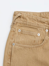 Close-up of the front pocket area of Blue de Gênes BGgiacomo Color Jeans - Tanin, highlighting the stitching, belt loop, and metal rivets on rigid denim against a white background.