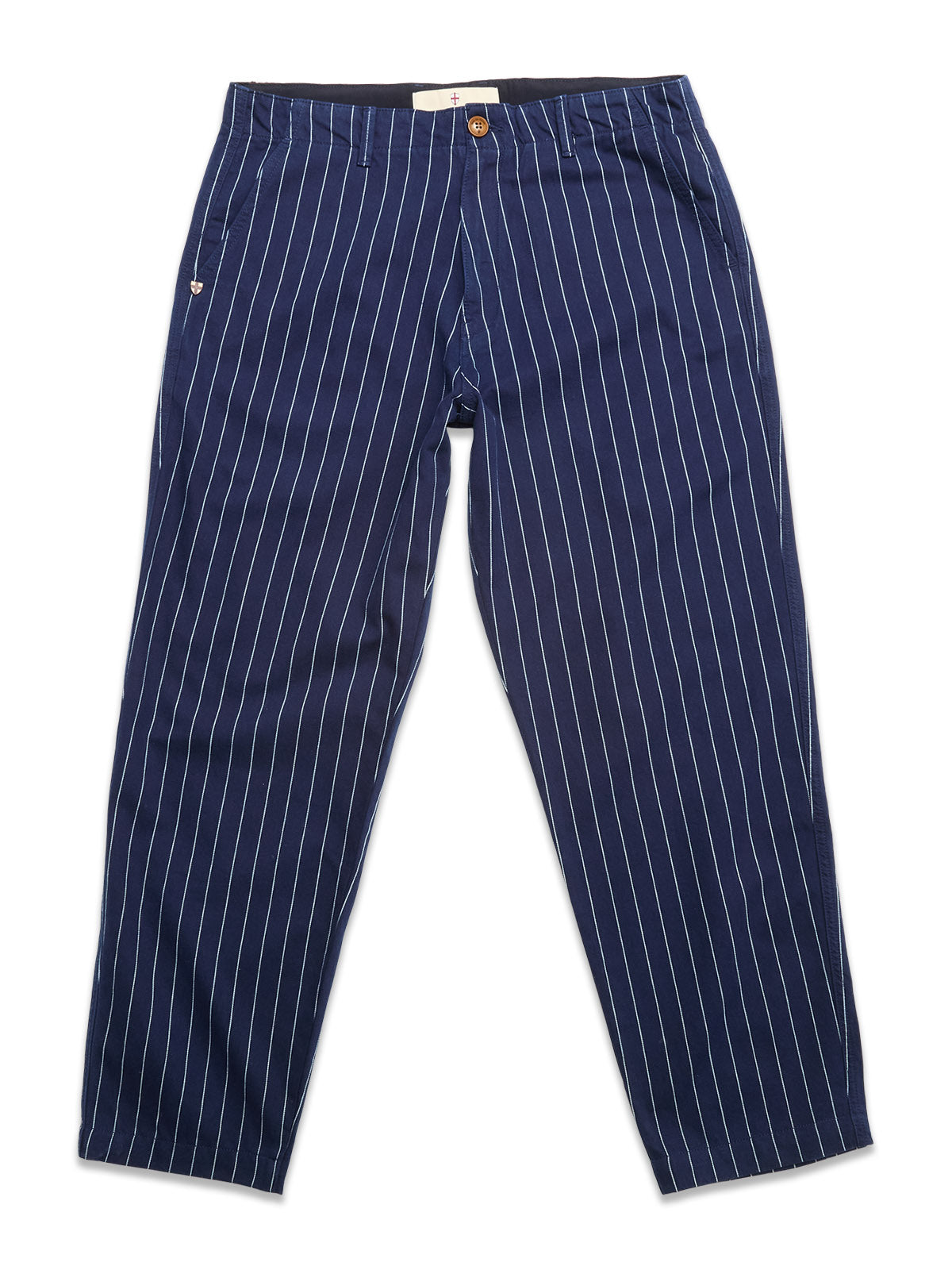 BGpalco Toll Pants - Navy Stripe by Blue de Gênes, featuring white vertical pinstripes, a button and zip closure, tapered leg, and side pockets, shown laid flat on a white background.