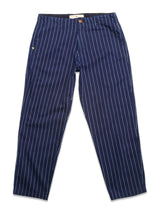 BGpalco Toll Pants - Navy Stripe by Blue de Gênes, featuring navy cotton chino fabric with white vertical pinstripes, a button closure, and front pockets, shown laid flat on a white background.