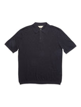 The BGwally Diamond Polo - Dark Navy by Blue de Gênes is a dark navy short-sleeve polo shirt with a collar and three buttons, crafted from a lightweight knit fabric in a cotton-linen blend, displayed flat on a white background.
