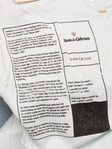Close-up of a shirt label for BGvinci Hera Used Jeans by Blue de Gênes, showing printed text about Leonardo da Vinci, care instructions, and info on these regular fit jeans made from used look comfort stretch denim.