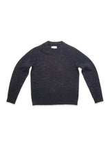 The Honshu Crewneck Knit - Navy by Blue de Gênes is a chunky knit sweater in dark navy, laid flat on a white background. It features long sleeves, a classic crew neckline, and is crafted from a lambswool blend with tiny colorful flecks throughout.
