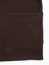 Close-up of the Kojima Wool Jacket - Chocolate by Blue de Gênes, showcasing its dark brown boiled wool and a rectangular flap patch pocket against a white background.
