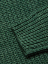 Close-up of the Blue de Gênes Yomaha Halfzip Knit in Scarab, highlighting the ribbed texture and detailed sleeve cuff overlapping the body of the wool blend sweater.