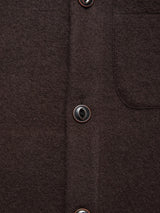 Close-up of a dark brown Blue de Gênes wool shirt with two front buttons and a chest pocket, ideal for pairing with the Blue de Gênes Koi Wool Gilet - Chocolate.