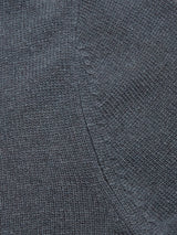 Close-up of the Blue de Gênes Nuvali Polo Cardigan in Dark Slate, showcasing its detailed texture and stitching, with a curved seam featured on the middle right side.
