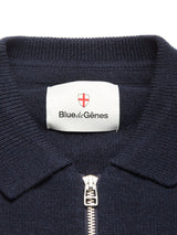 Close-up of the Nuvali Polo Cardigan in navy by Blue de Gênes, featuring a collar, zipper, and white label with a red shield logo—perfect for men's layering.