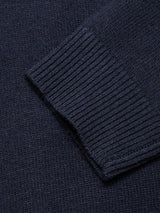 Close-up of the Nuvali Polo Cardigan in navy by Blue de Gênes, highlighting the ribbed cuff and textured knit—ideal for men’s layering.