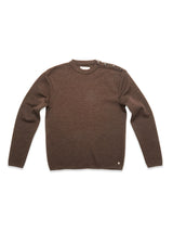 The Blue de Gênes Toyama Knit L/S in brown is a Danish-made Merino wool crewneck sweater with long sleeves and four dark buttons on the left shoulder, shown laid flat on a white background.