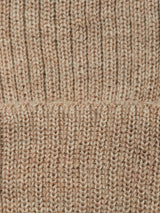 Close-up of beige knitted fabric with a vertical ribbed pattern. A horizontal seam runs across the center, revealing slight texture and color variations—characteristic of the Boshi Beanie - Oat by Blue de Gênes, expertly crafted in Denmark.