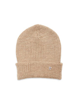 The Boshi Beanie - Oat by Blue de Gênes is a beige Merino wool hat featuring a folded brim and a small embroidered cross patch on the front, knitted in Denmark and shown against a white background.