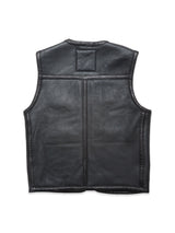 A rear view of the Blue de Gênes Saga Shearling Gilet - Scarab reveals a plain, undecorated black leather design with minimal seams and no visible pockets or closures—emphasizing the clean lines characteristic of German Merino sheepskin craftsmanship.