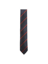 The Blue de Gênes Nekutaki Tie #B - Navy Stripe is a classic men’s necktie featuring dark navy blue fabric with evenly spaced thin diagonal red stripes, showcased against a plain white background. This timeless accessory adds sophistication to any formal outfit.