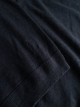 Close-up of the Blue de Gênes BGmonty Knit in Dark Navy, a cotton-linen blend crewneck jumper featuring fine texture, a roll-rib hem, and an embroidered detail near the hem.