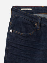 Close-up of Blue de Gênes BGrepi Dai V Dark V2 Jeans in dark blue denim, highlighting the front pocket, a shield-shaped pin, and a "Made in Italy" label with the Italian flag inside the waistband.
