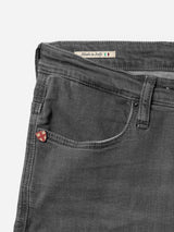 Close-up of Blue de Gênes BGrepi Giulio Light V2 Jeans in grey denim, highlighting the front pocket with a shield-shaped pin and a “Made in Italy” label featuring a small Italian flag above the pocket.