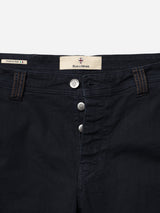 Close-up of the waistband and upper front of BGpaulo Pavia 1 V2 Chino in Midnight Blue by Blue de Gênes, showing metal buttons, tan stitching, belt loops, and a label—crafted in Italy from soft cotton stretch fabric for comfort.
