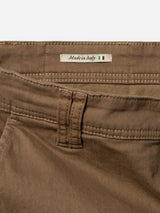 Close-up of Blue de Gênes BGpaulo Pavia 1 V2 Chino pants in Fudge, highlighting a belt loop, pocket seam, and a fabric label reading Made in Italy with a small Italian flag.