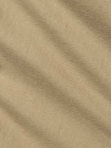 Close-up of the BGpaulo Pavia 1 V2 Chino in Khaki by Blue de Gênes, showcasing tan fabric with soft diagonal folds and a textured, woven surface that evokes classic cotton stretch chinos or vintage military pants.