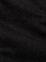 Close-up of the BGvinci TrueBlack Jeans - Black Denim by Blue de Gênes, showcasing a black denim fabric with a subtle diagonal weave texture and soft folds, delivering a smooth and slightly matte finish that evokes the classic look and comfort stretch feel of premium black wash jeans.