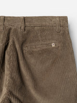 Close-up of the BGpalco Cord Chino in Sepia Tint Brown by Blue de Gênes, highlighting the waistband, belt loops, and a single back pocket adorned with a small rectangular logo tag above the pocket.