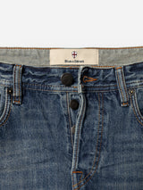 Close-up of the BGgiacomo Alfie Jeans in mid blue denim, featuring visible stitching, three black buttons, belt loops, and a Blue de Gênes brand label on the inner waistband. Crafted from comfort stretch denim, these jeans offer a relaxed loose fit for all-day comfort and effortless style.